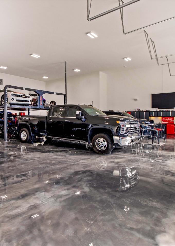 Garage View With Truck and Other Vehicles)